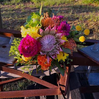 Mudgee Monkey is a local based florist in the Mudgee Area. Pictured is a large bouquet of bright flowers featuring local native Mudgee flowers.